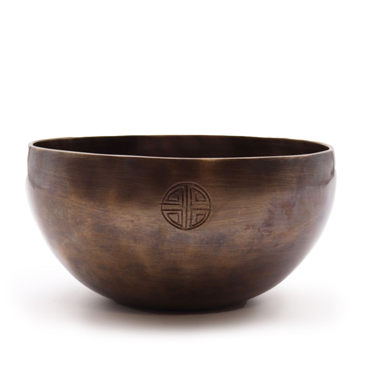 Large hand-hammered brass singing bowl featuring etched moon phase symbols around the outer rim.
