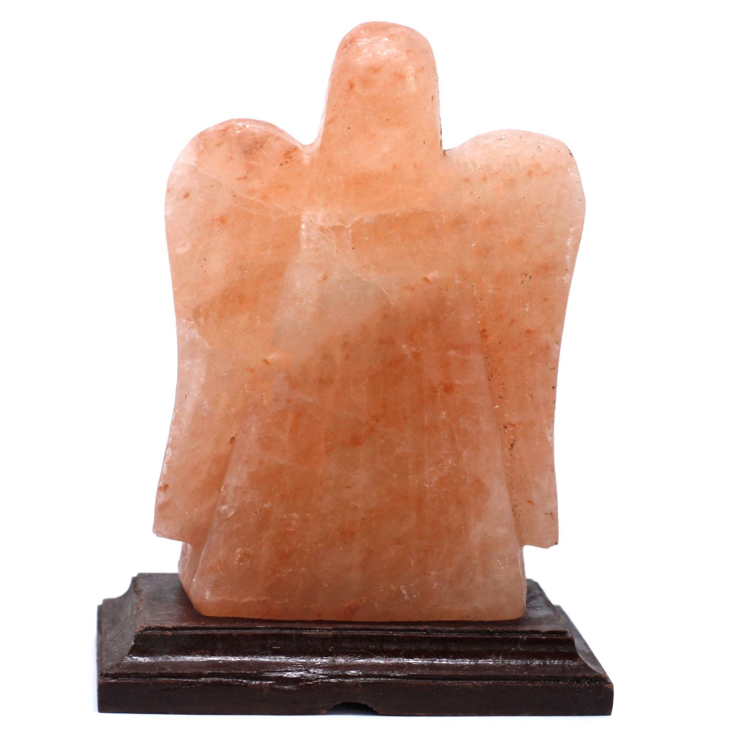 Hand-carved angel shaped Himalayan salt lamp on a wooden base emitting a warm orange glow.