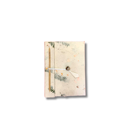Handmade Lokta paper notebook with a natural textured cover embedded with delicate real dried colourful flowers.