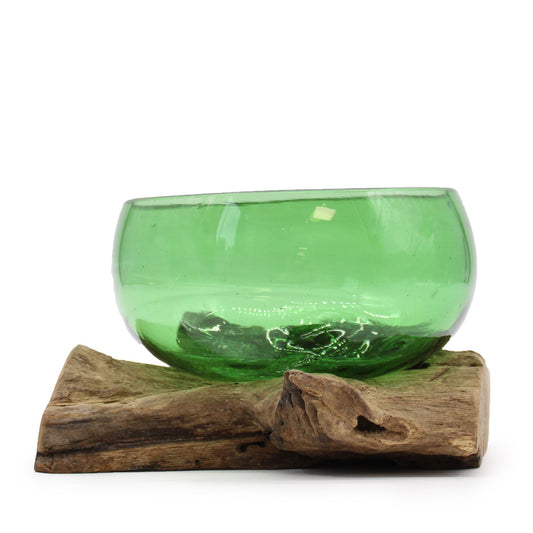 Wide decorative bowl made from molten recycled green glass slumped over a natural organic wood root base.