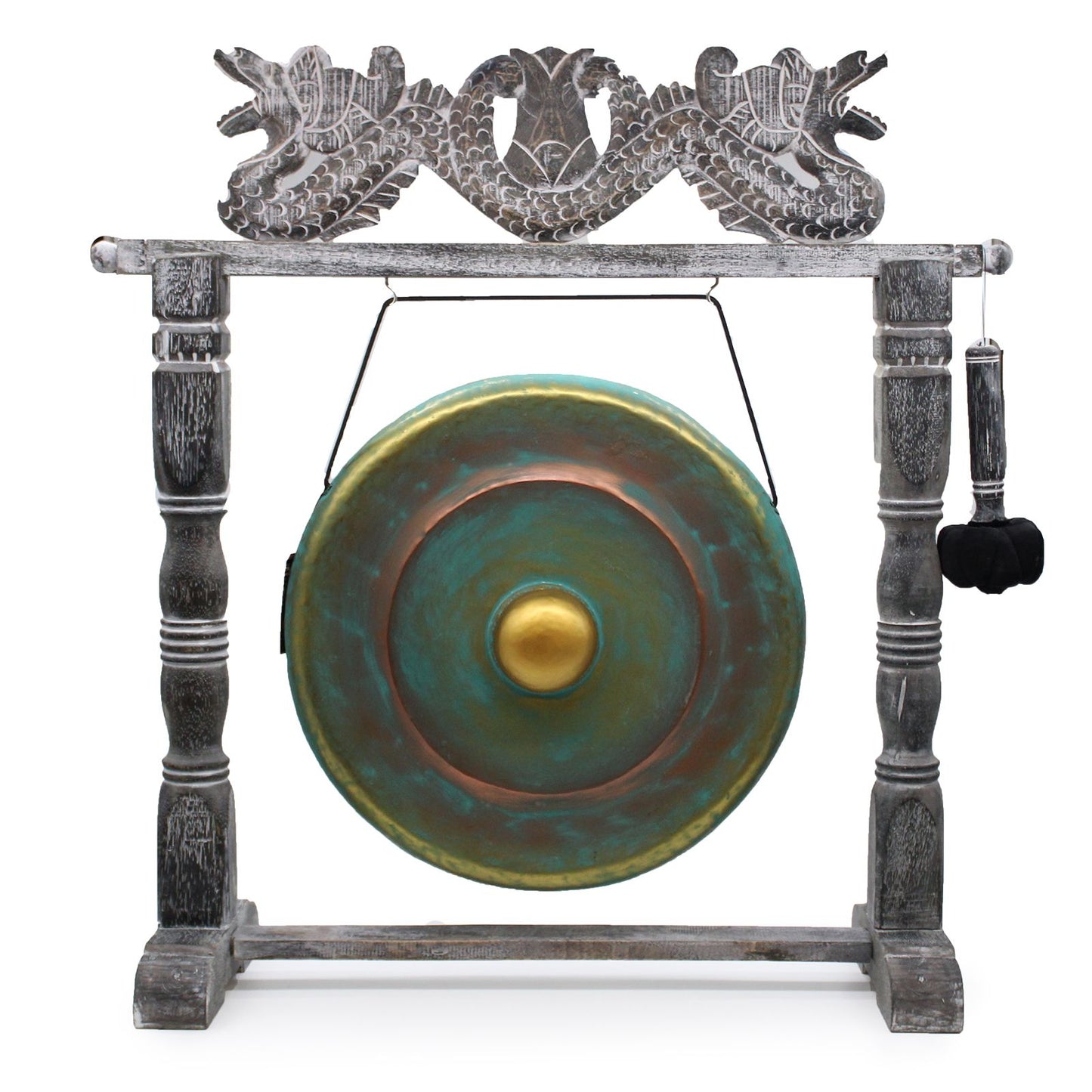 Handcrafted circular metal gong with a greenwash finish suspended in an ornate, dark wood-carved standing frame.