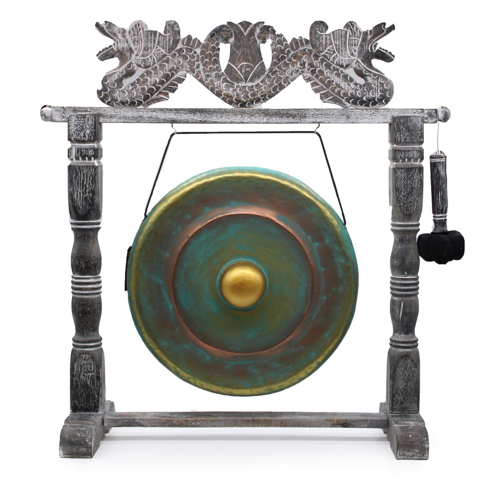 Handcrafted circular metal gong with a greenwash finish suspended in an ornate, dark wood-carved standing frame.