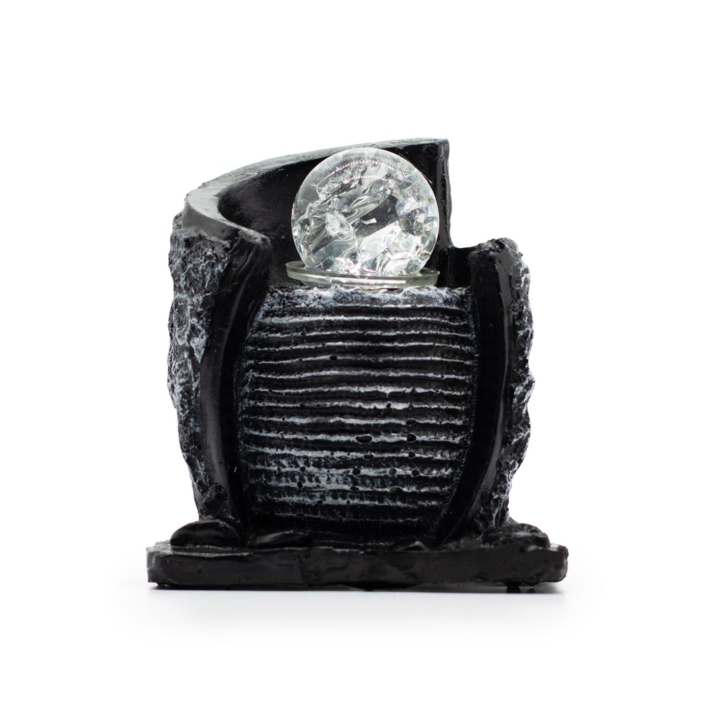 Stone-effect tabletop water feature with a ribbed water pot, crystal ball, and charcoal rock forms.