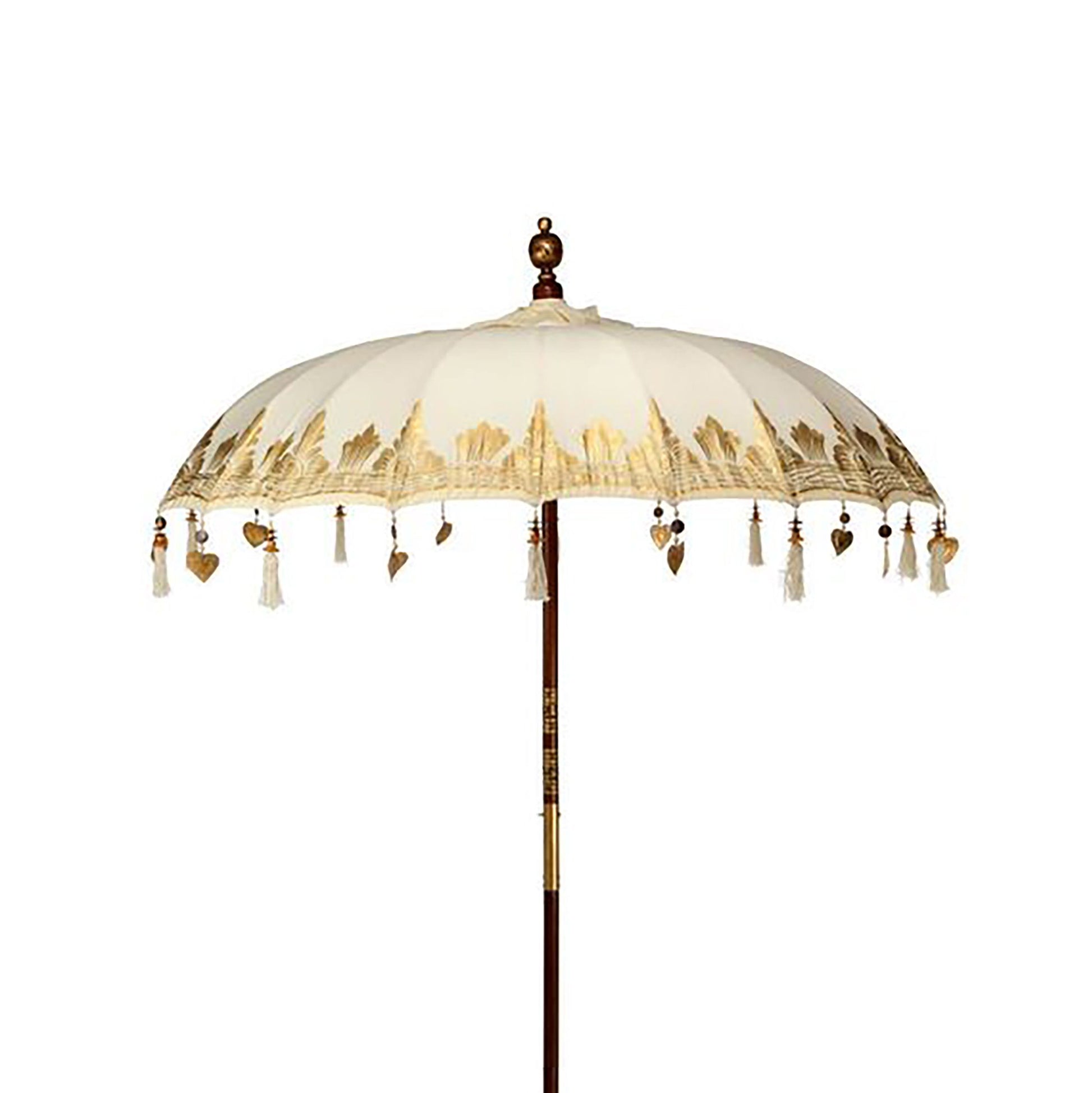 Handcrafted 2m natural canvas patio parasol with gold patterns and fringe detailing against a clear sky.
