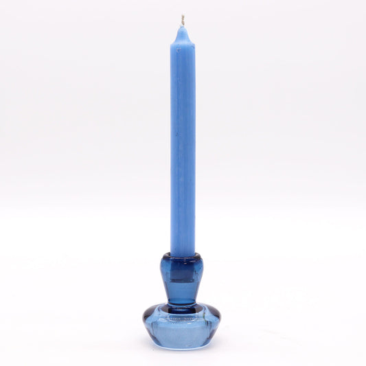Royal blue glass candle holder with a mushroom shape that flips to hold either a taper dinner candle or a small tealight.