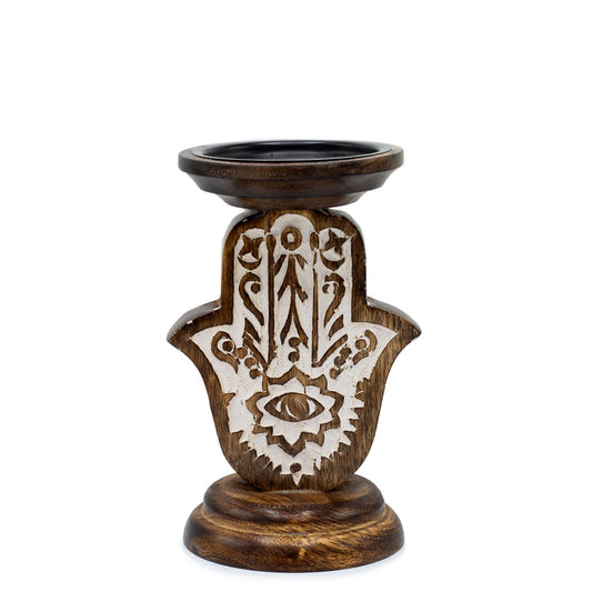 Small hand-carved mango wood candle holder featuring a detailed Hamsa symbol with natural wood grain finish.