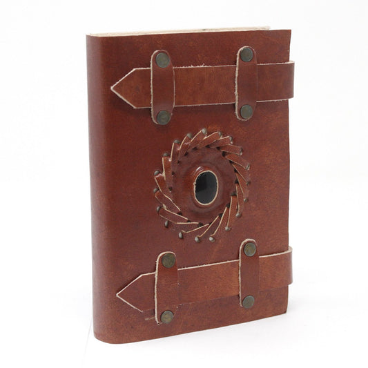 Handcrafted vintage-style black leather journal with decorative metal buckles and a wrap-around strap.
