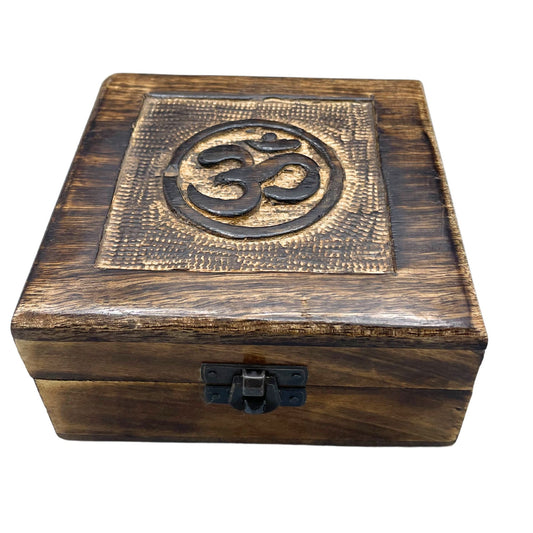 Square hand-carved wooden keepsake box featuring a central Om symbol on the lid with decorative floral carvings.
