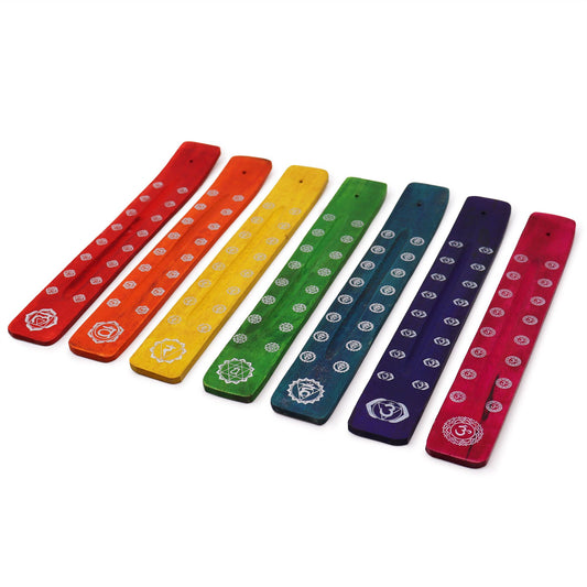 Set of seven colourful wooden incense ashcatchers with unique chakra symbol designs and floral patterns.