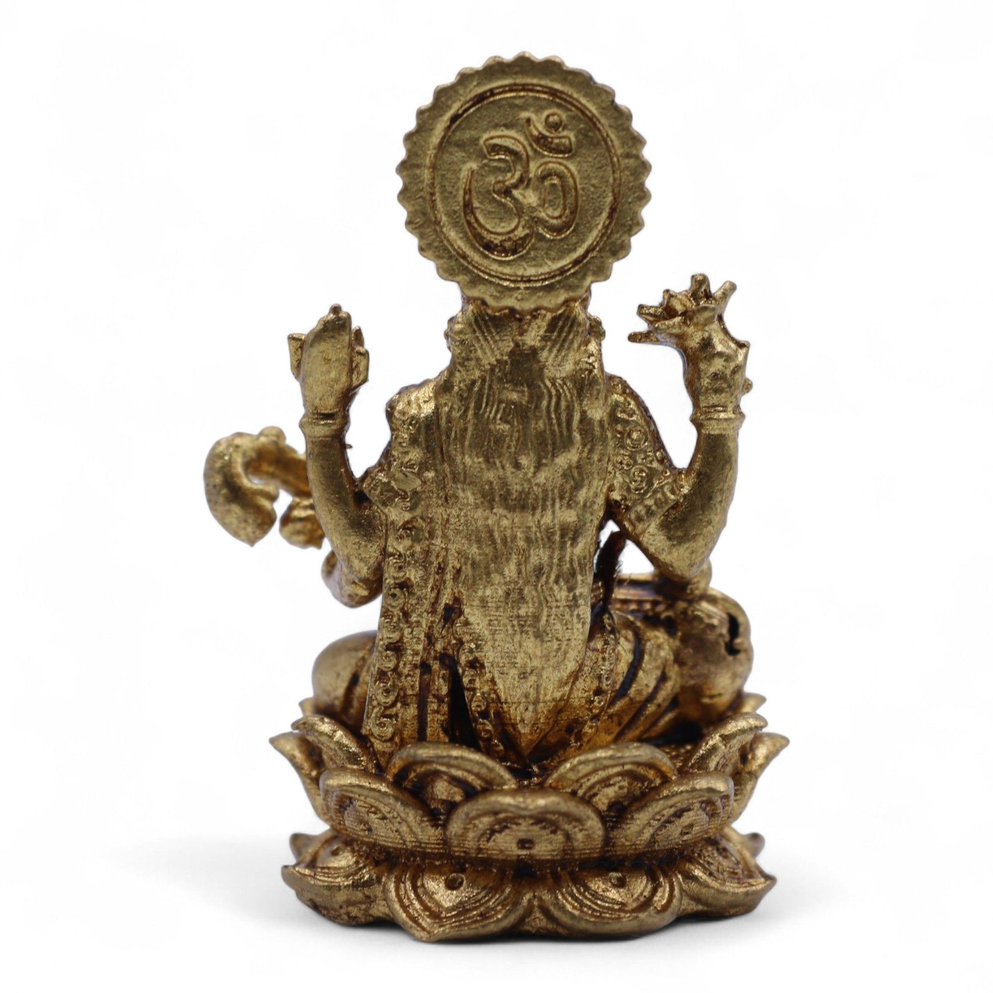 Detailed miniature brass figurine of the Hindu goddess Saraswati sitting on a lotus base holding a veena.