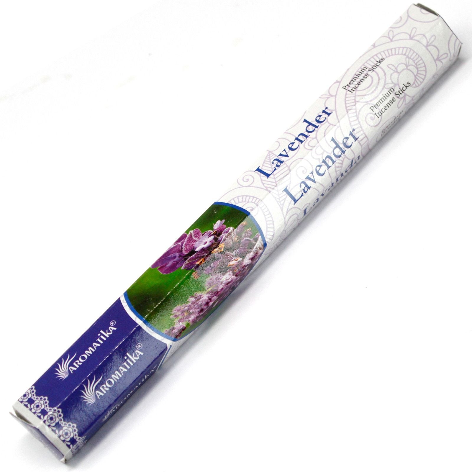 Hand-rolled natural masala incense sticks with a calming lavender fragrance on a wooden surface.