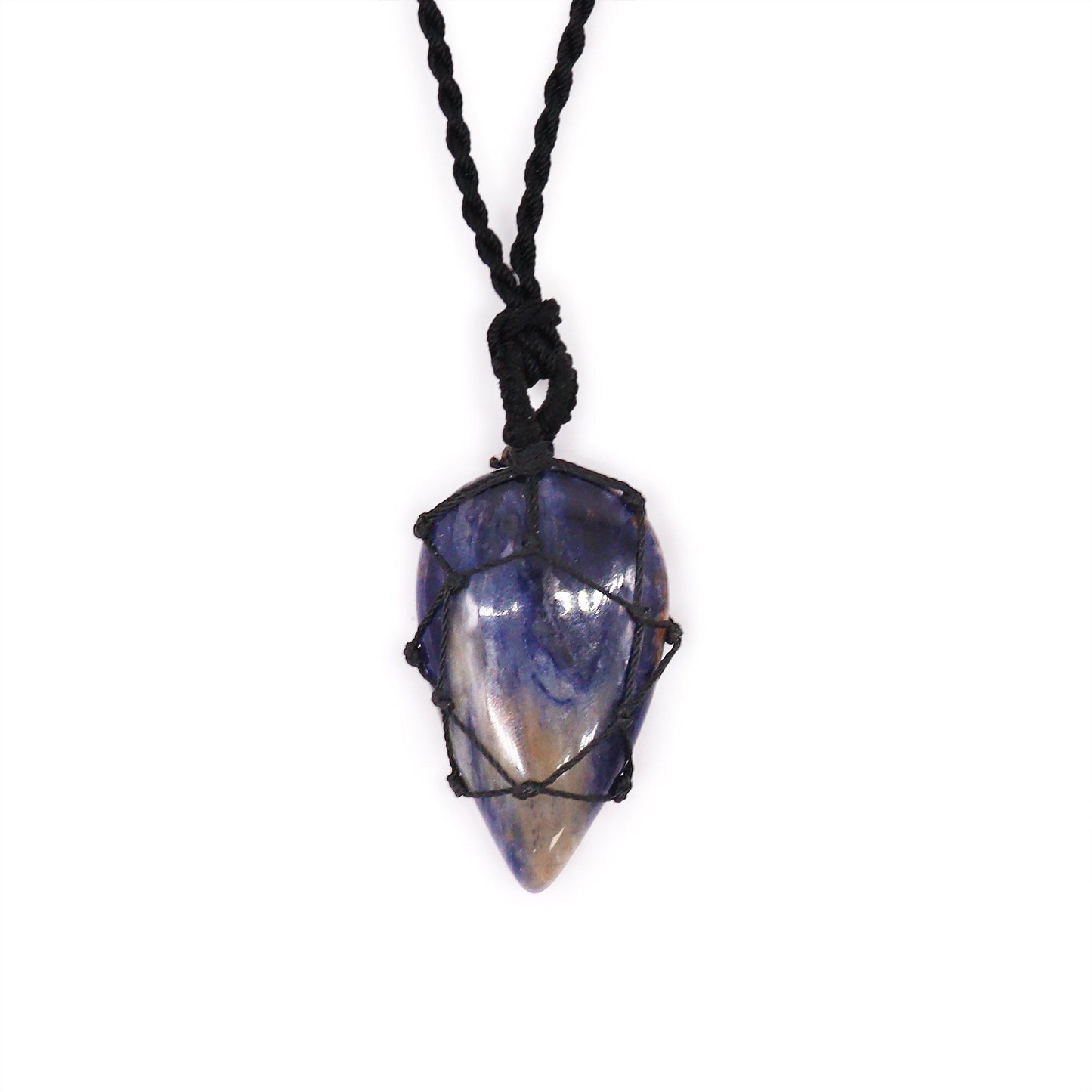 Handcrafted teardrop-shaped sodalite gemstone pendant with an intricate laced metal border in a deep blue marbled finish.