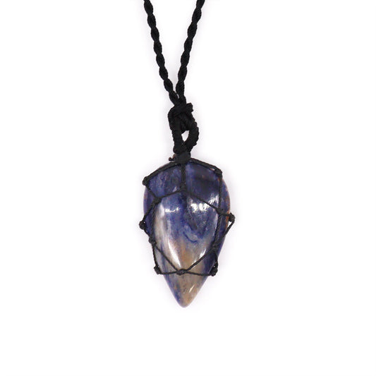 Handcrafted teardrop-shaped sodalite gemstone pendant with an intricate laced metal border in a deep blue marbled finish.