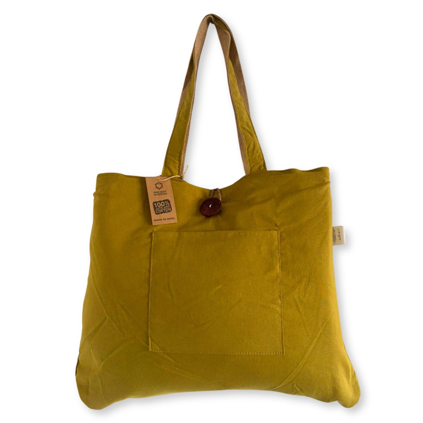 Large reversible pistachio green and cream tote bag made from woven jute and cotton with sturdy shoulder handles.