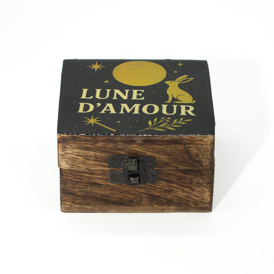 Small round mango wood box with an enamelled lid depicting a golden moon, stars, and a hare against a dark night sky.