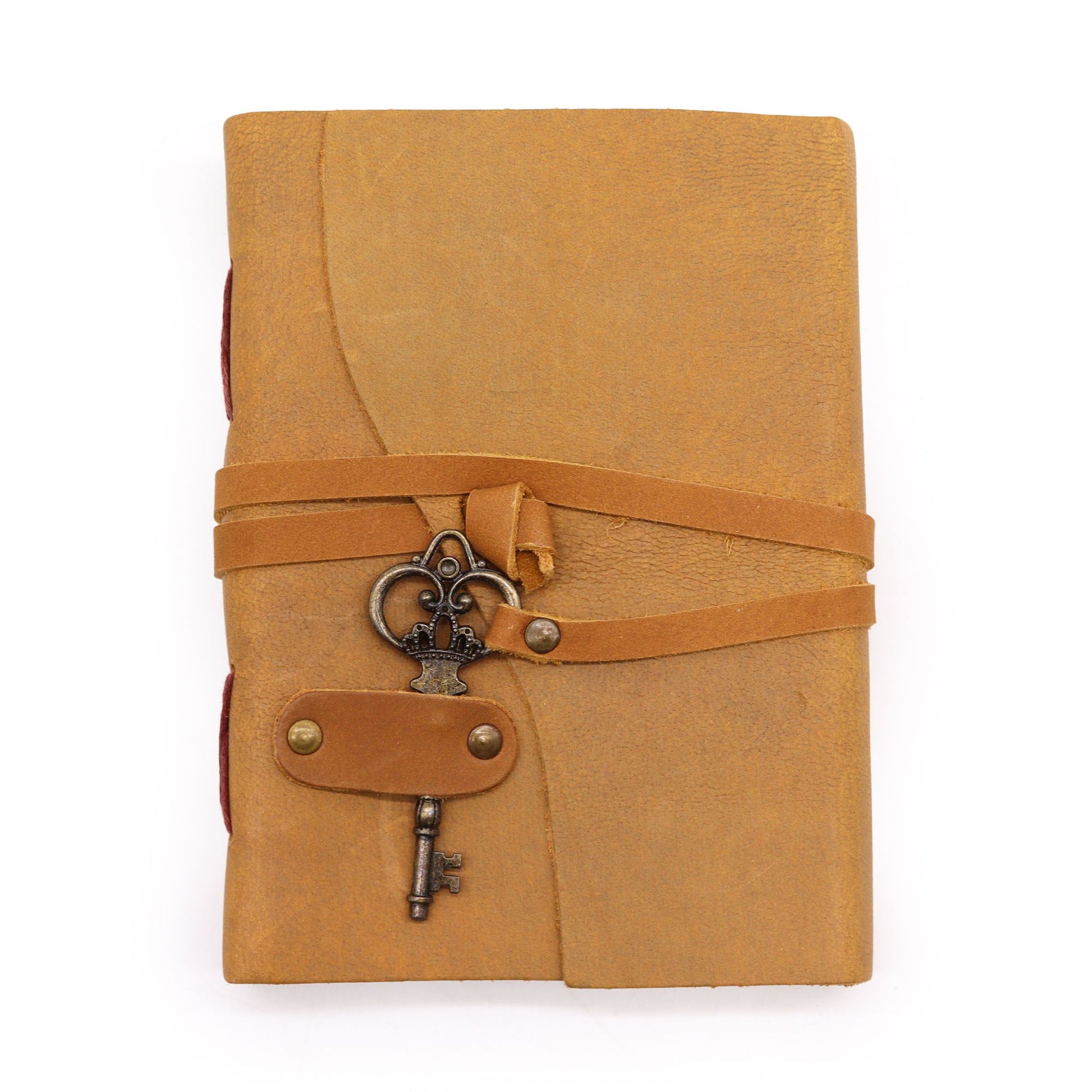 Handcrafted oiled tan leather notebook featuring a vintage-style wrap-around strap and a decorative brass-coloured key.