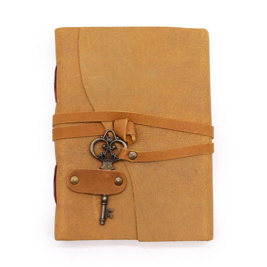 Handcrafted oiled tan leather notebook featuring a vintage-style wrap-around strap and a decorative brass-coloured key.
