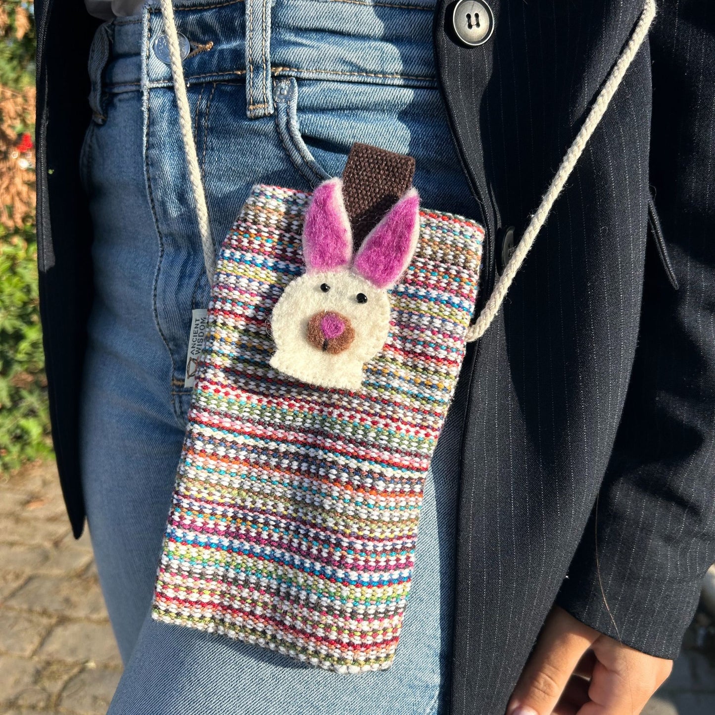 Handmade pink and white striped phone holder bag with a cute decorative bunny detail and a long strap.