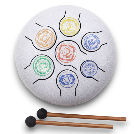 A compact steel tongue drum featuring colourful 7 chakra symbols on a dark finish with two wooden mallets.
