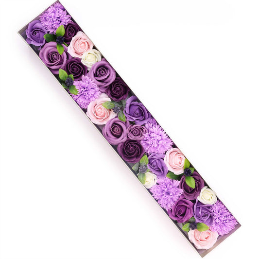 Extra long gift box filled with realistic soap flowers in shades of lavender, rose, and carnation pink.