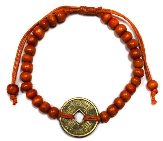 Orange beaded bracelet with traditional Chinese coins of fortune and wooden beads.