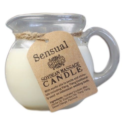 Creamy white soy wax candle in a clear glass jar featuring a warm floral aromatherapy blend.