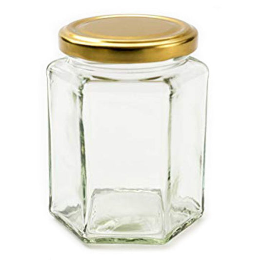 Clear hexagonal glass jar with a metal twist-off lid, suitable for preserves or candle making.
