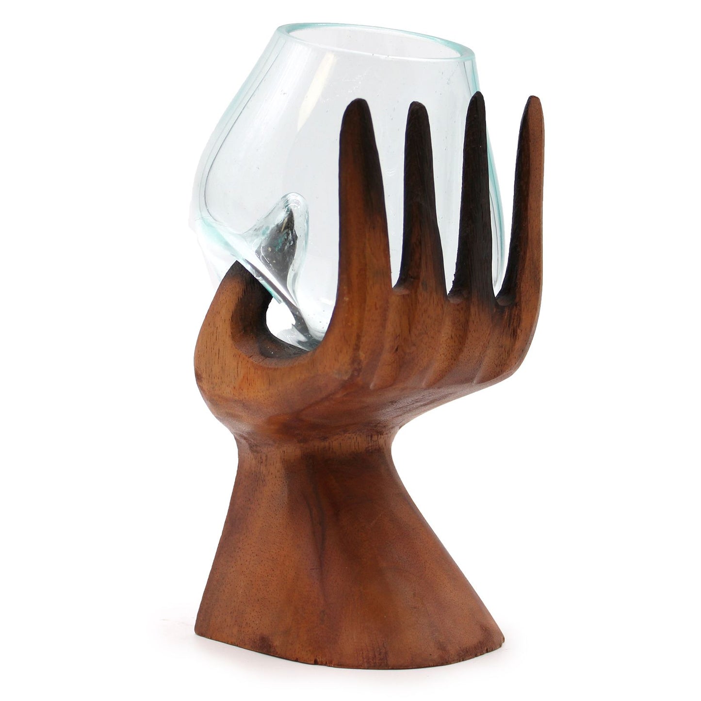 Handcrafted carved wooden hand supporting a unique molten glass bowl on a rustic wood stand.