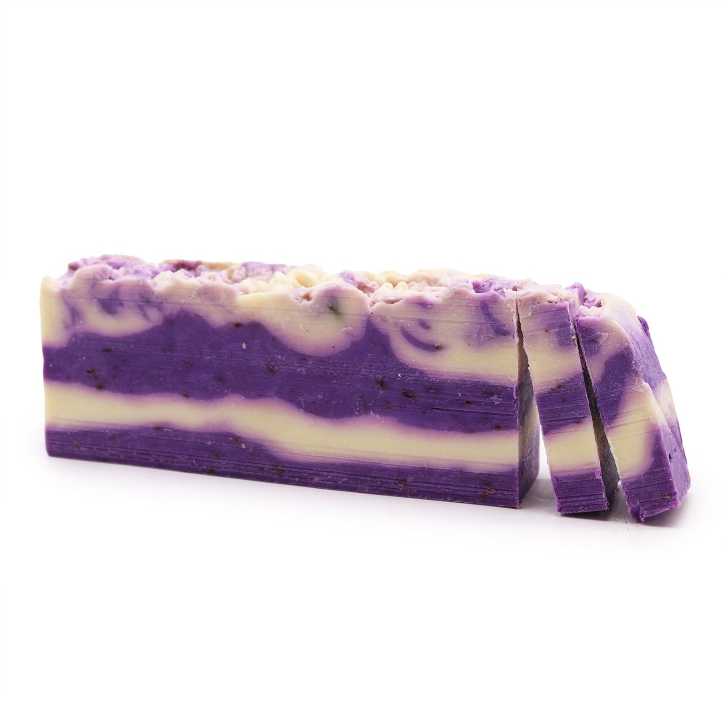 A rustic, handcrafted lavender and olive oil soap loaf with a textured surface and natural purple hue.