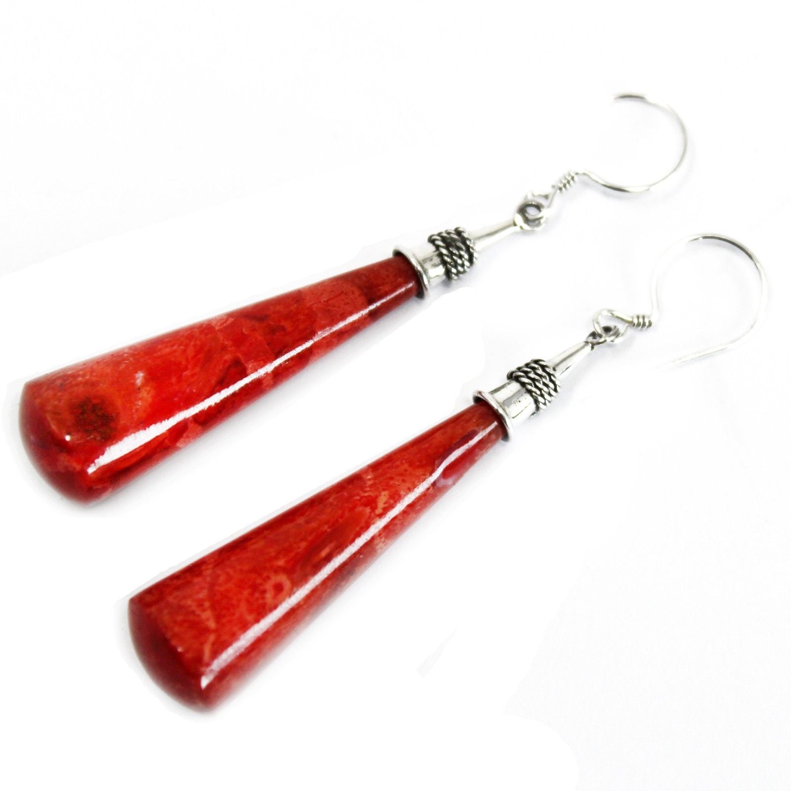 Elegant 925 sterling silver long teardrop dangle earrings featuring vibrant red coral imitation stones.