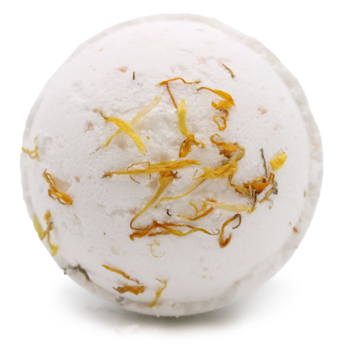 Large round Himalayan salt bath bomb with a natural pink hue and textured surface in a wellness setting.