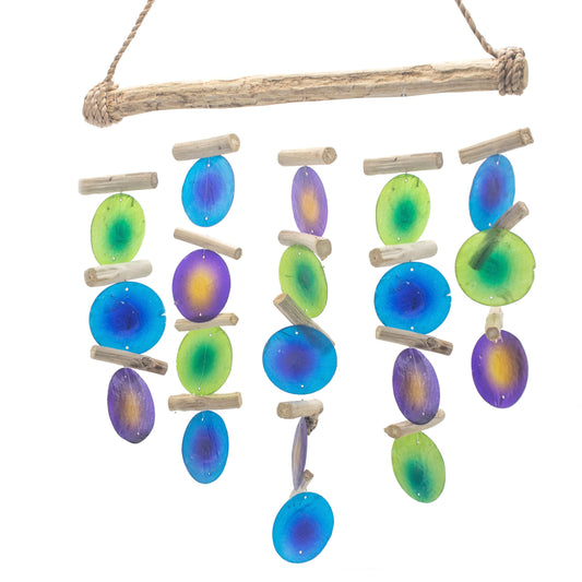 Handcrafted wind chime featuring natural driftwood and vibrant green and purple Capiz shells.