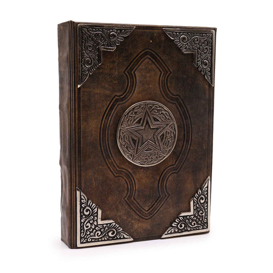 Large brown tan leather notebook with a decorative zinc pentagon on the cover and vintage deckle-edged paper.