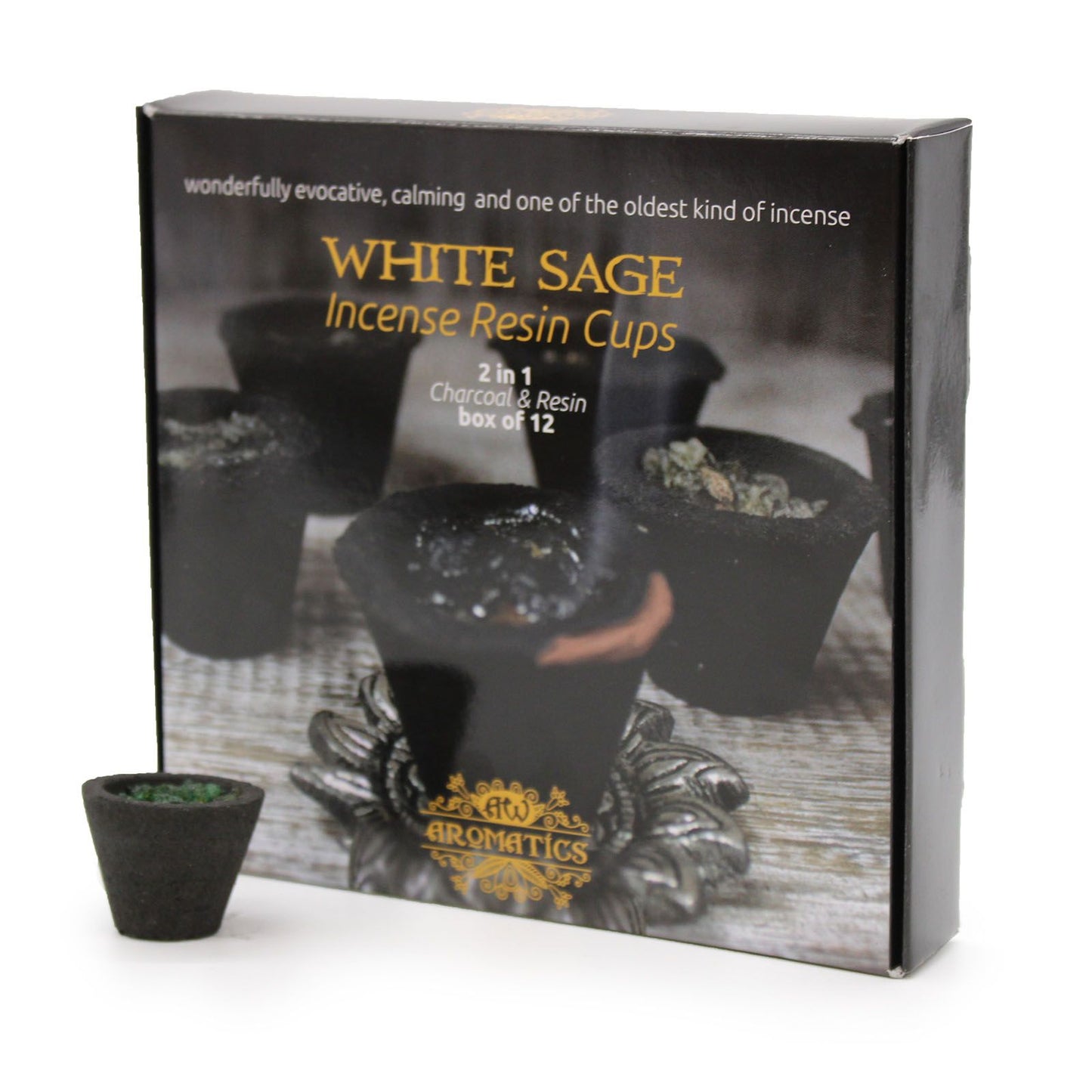 Box of twelve charcoal resin cups filled with white sage incense sitting on a wooden surface.