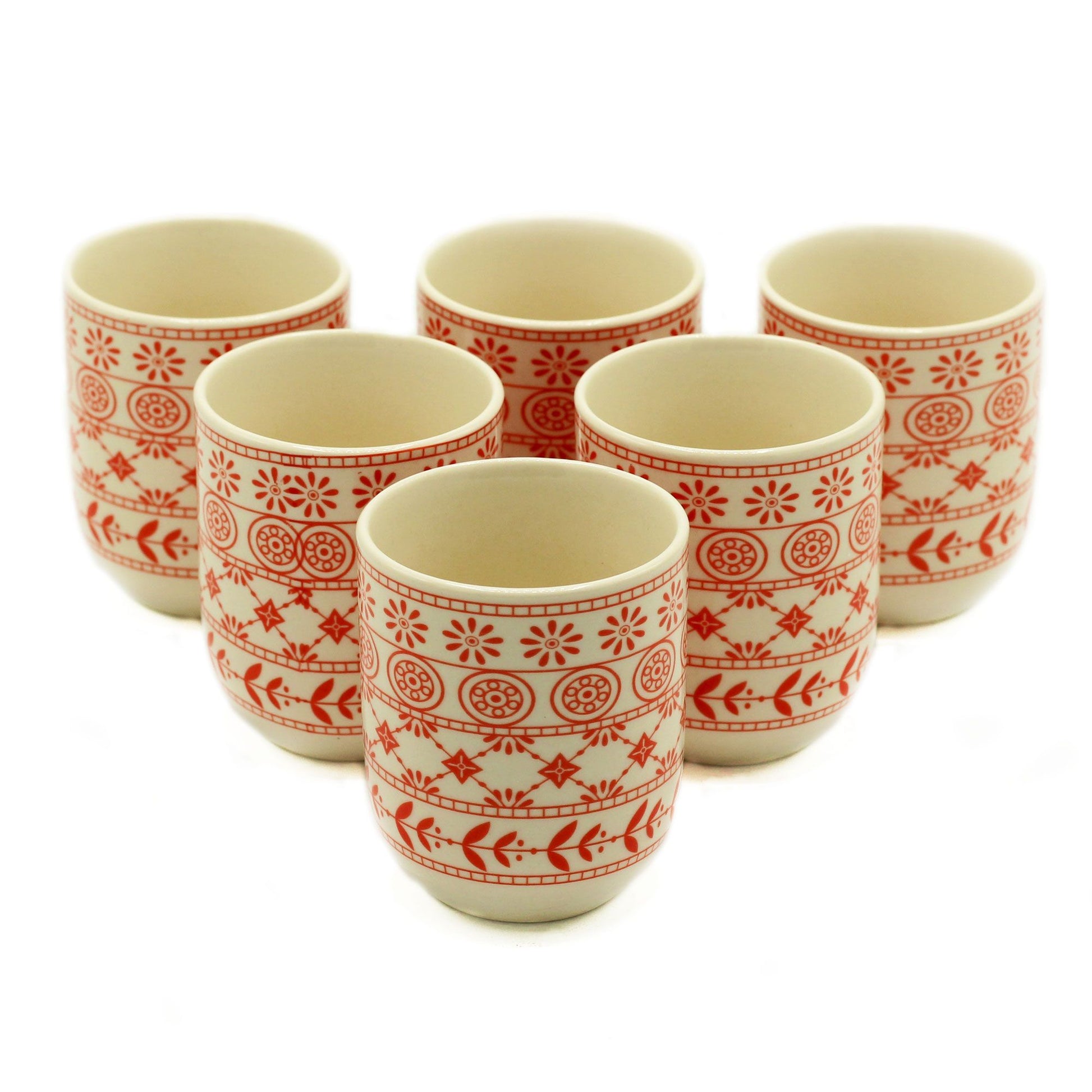 Pair of translucent amber-coloured glass tea cups with a minimalist design for herbal infusions.