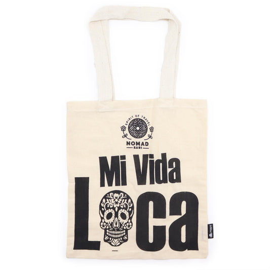 Natural cream-coloured cotton tote bag with a minimalist black typographic design reading Mi Vida Loca.