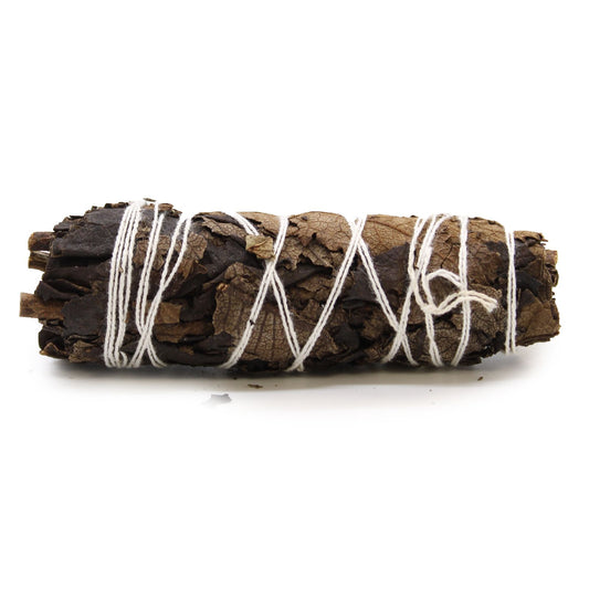 Hand-tied black sage smudge stick bundle, approximately 10cm long, showing dried dark green leaves.