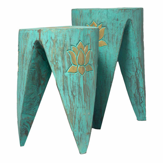 Two vibrant turquoise wooden interlocking tables with intricate tribal carvings and a matching stool set design.