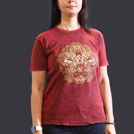 Front view of a maroon stonewashed t-shirt featuring a central Hamsa hand symbol in a distressed nomadic style.