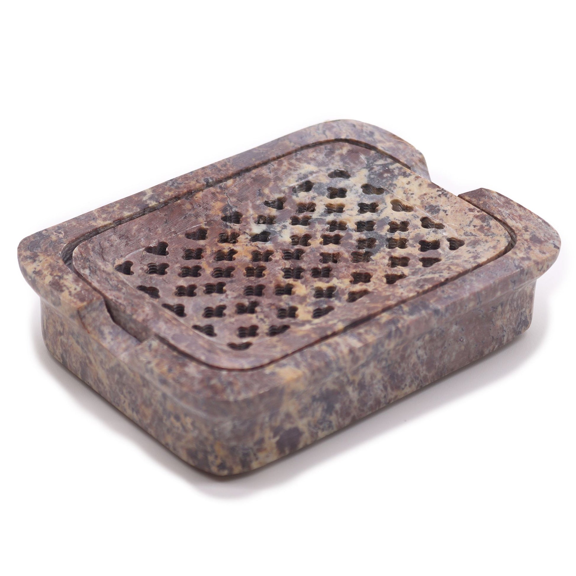 Square grey soapstone soap dish with carved drainage slats on a flat surface.