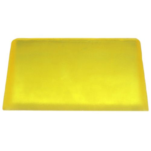 A textured yellow artisan soap slice containing real lemon essential oil, showing its natural handcrafted quality.