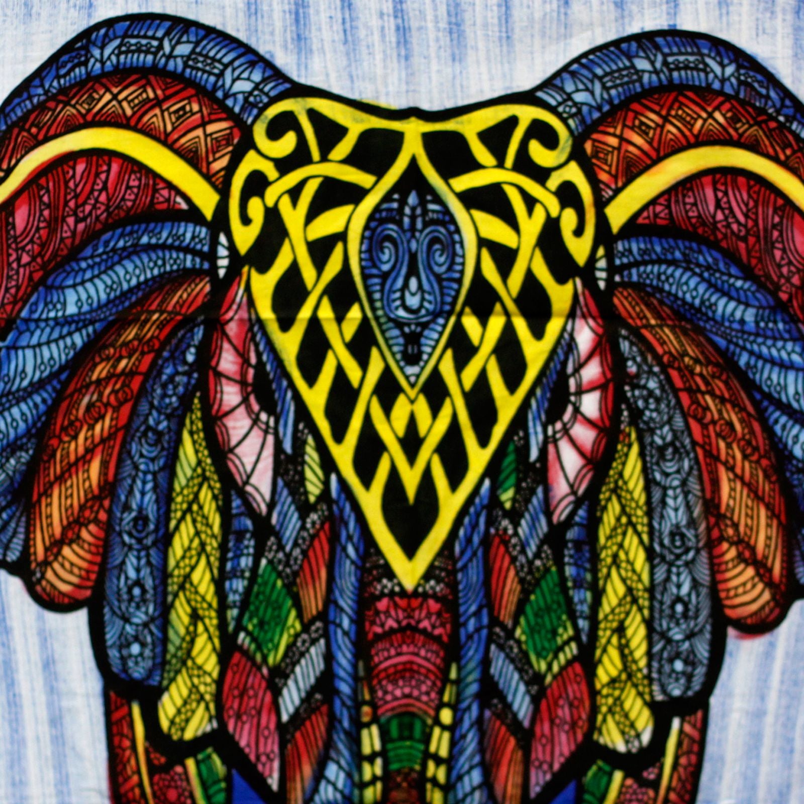 Vibrant handbrushed cotton wall hanging featuring a detailed elephant design with bold colours and artistic patterns.
