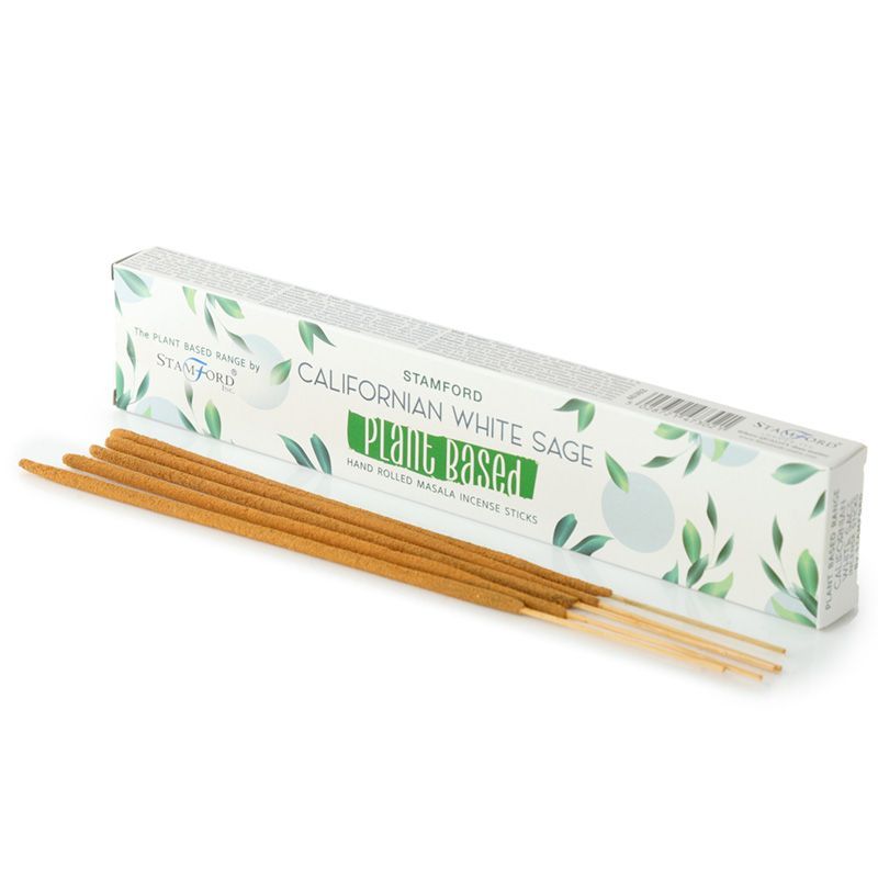 Hand-rolled natural masala incense sticks with a bundle of dried white sage on a wooden surface.