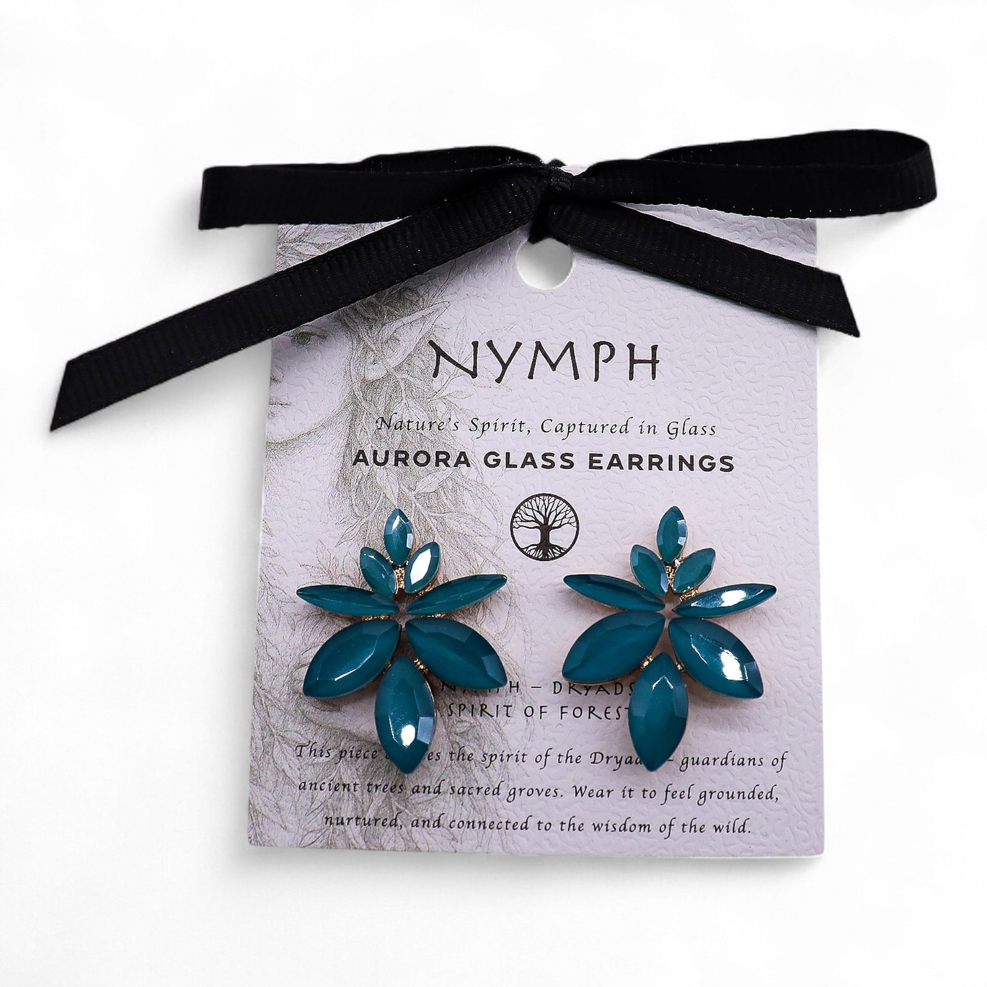 Delicate teal green vintage glass earrings shaped like flowers with stainless steel frames on a plain background.