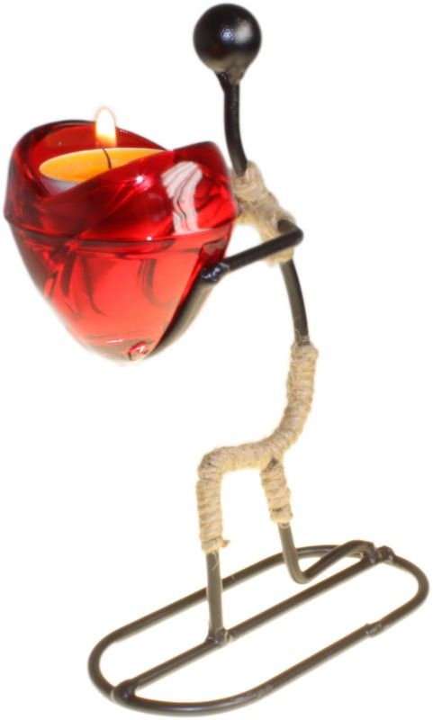 Detailed figurine of a man holding out a heart, designed as a decorative romantic candle holder.