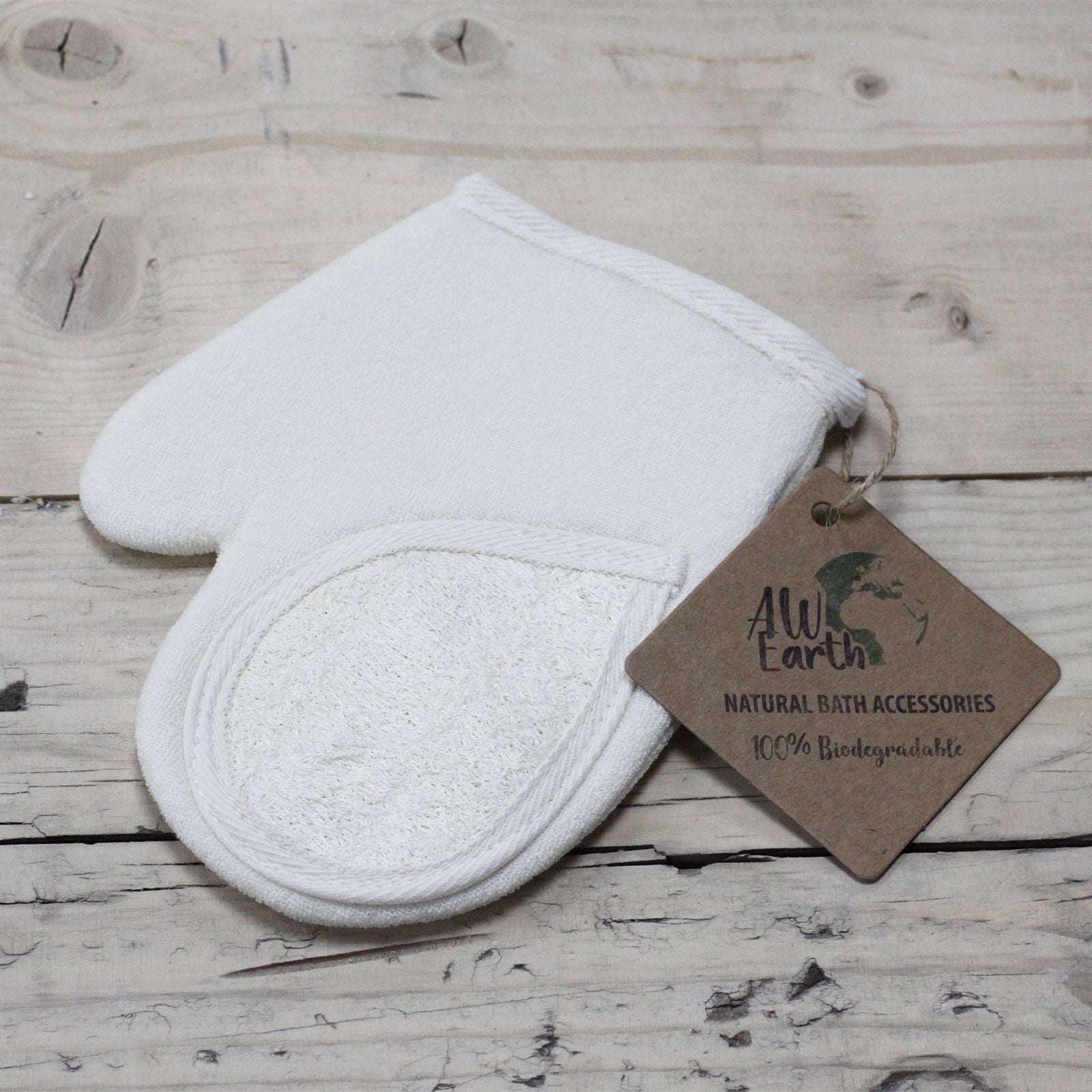 Textured cream-coloured natural loofah exfoliating glove with a soft fabric backing and elasticated wrist cuff.