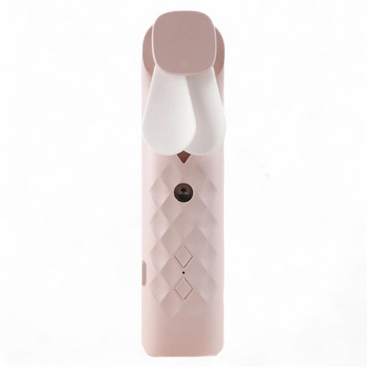 Compact pink handheld nano mist face fan and spray device with a sleek modern design.