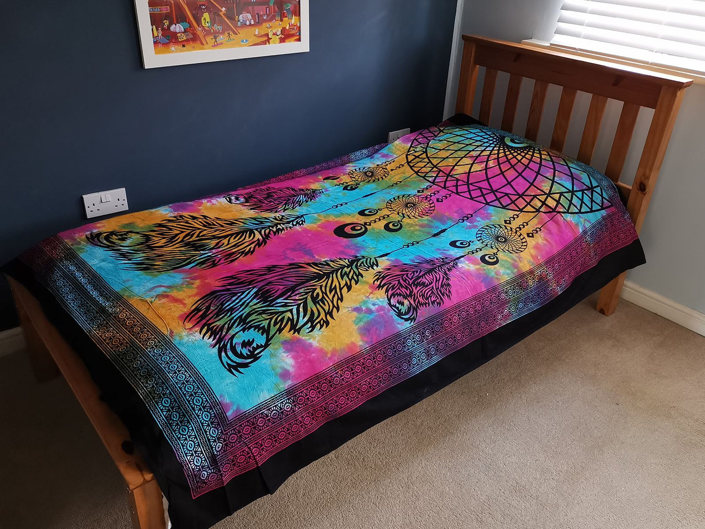Intricate dreamcatcher design on a single cotton bedspread, suitable for use as a bohemian wall hanging or bed throw.
