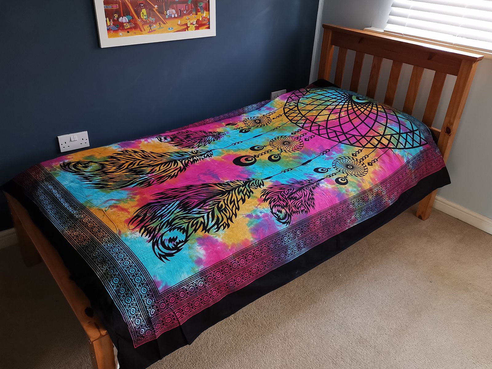 Intricate dreamcatcher design on a single cotton bedspread, suitable for use as a bohemian wall hanging or bed throw.