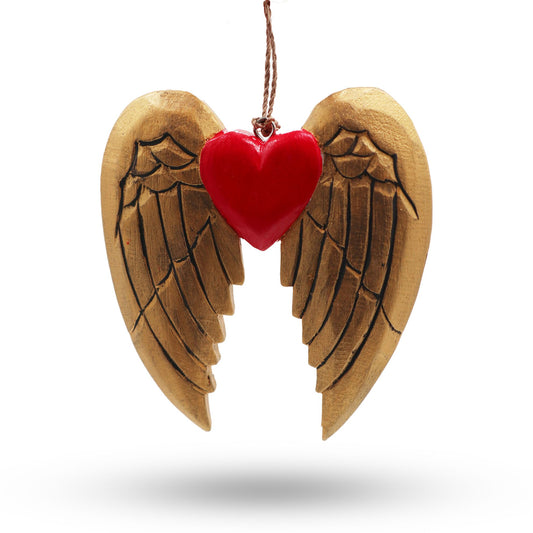Two hand-painted wooden Christmas ornaments featuring a golden angel wing and a heart with black detailed patterns.